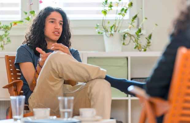 teen boy talking to a therapist