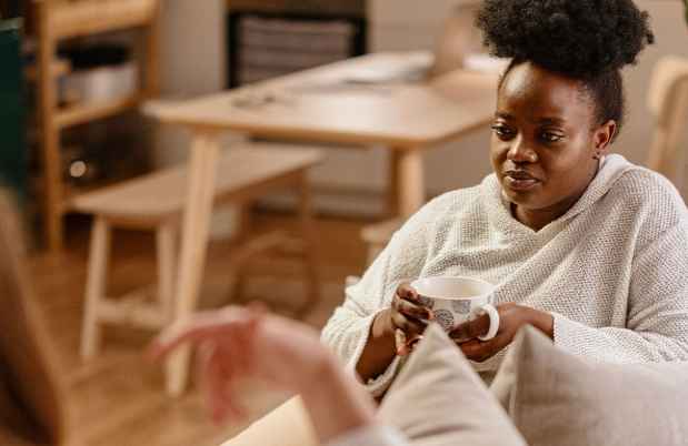 Two people sitting and talking