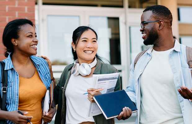 College students talking outside building