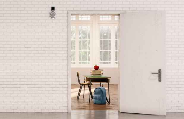 White brick wall and door looking into classroom