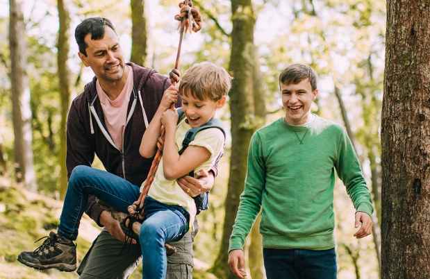 a family having fun in the woods