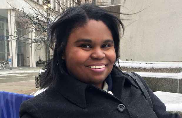 Deconstructing Stigma participant Paula - person in winter coat poses in snowy city