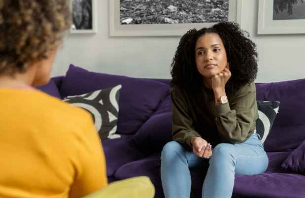 Patient and clinician talk in office