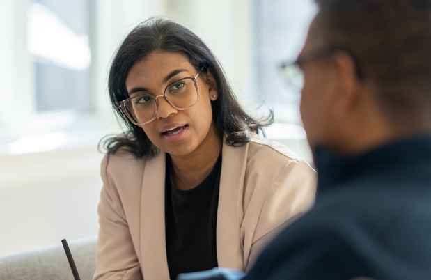 Clinician talks to patient