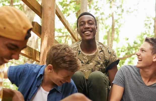Teens laugh outside