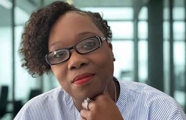 Deconstructing Stigma participant LaKisha - person in a striped shirt with hand to face