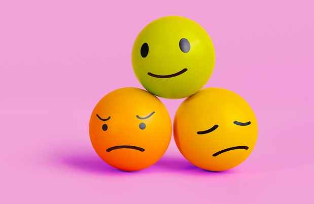 3 balls showing different face emotions