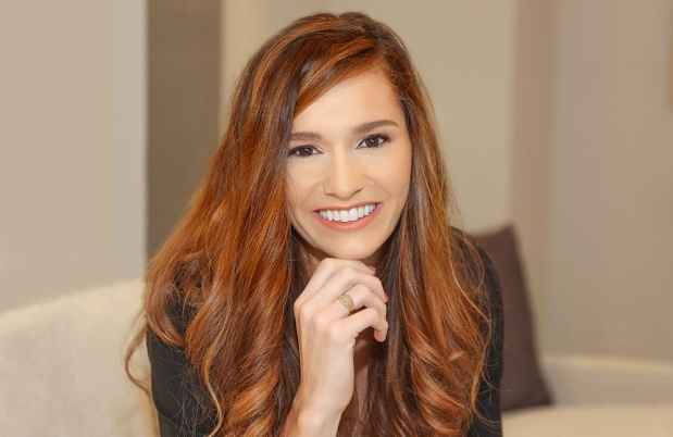 Participant Cali - person with long wavy hair smiling