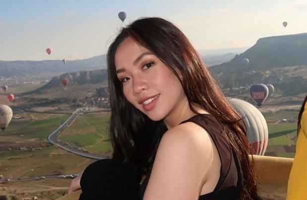 Deconstructing Stigma participant Josette - person in hot air balloon with vista of other flying balloons