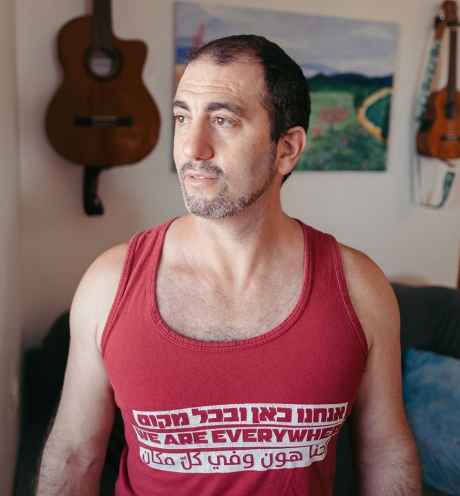 Deconstructing Stigma participant Leor - portrait of person in red tank top