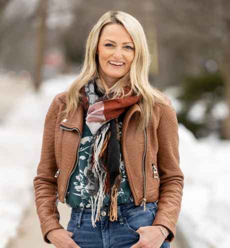 Participant Sarah - person with long blond hair smiling outside