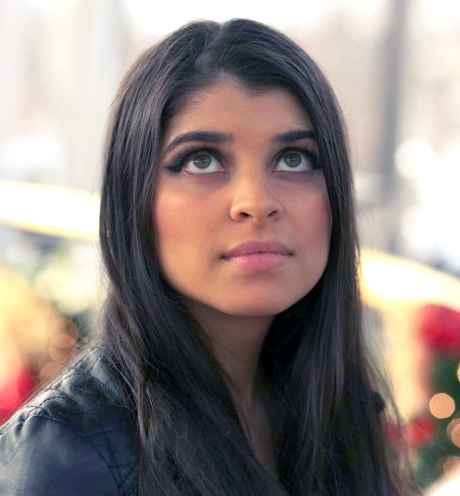 Participant Mrinal - person with wavy brown hair looking upwards