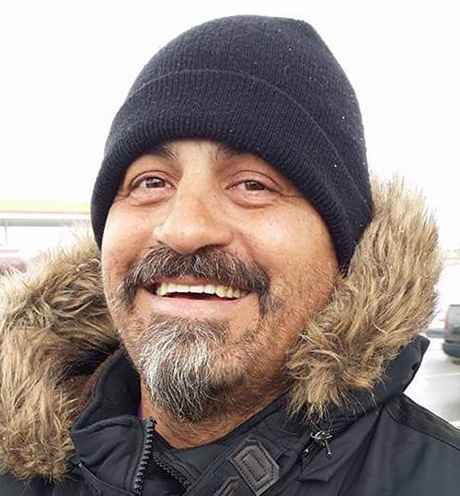Participant Ray - person smiling in a winter coat and a hat