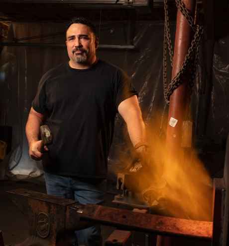 Participant Wayne - person with short dark hair with metalworking tools