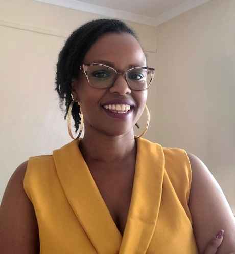 Participant Wariimi wearing glasses and smilling