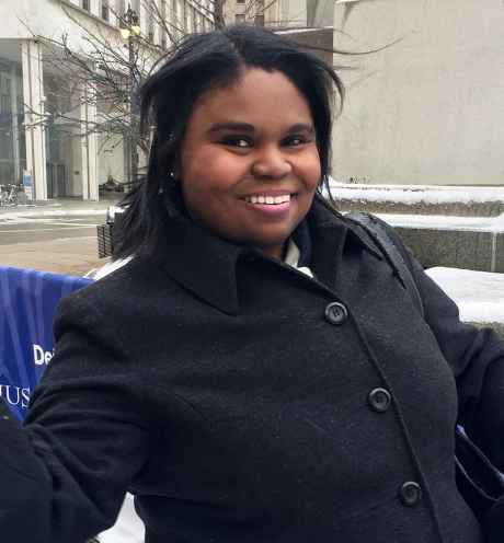Deconstructing Stigma participant Paula - person in winter coat poses in snowy city