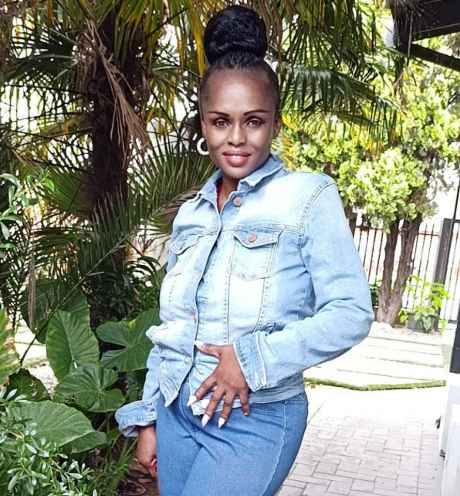Deconstructing Stigma participant Fancy - person in jeans outfit stands outside