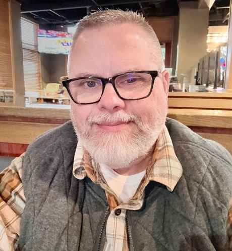 Deconstructing Stigma participant Noal - person in plaid shirt and vest