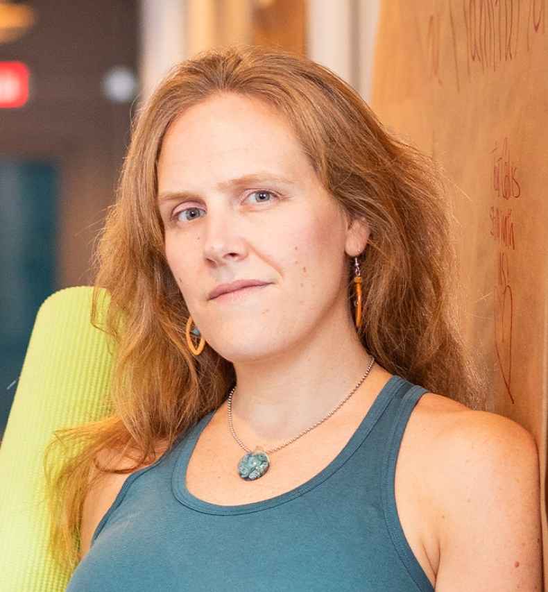 Participant Sandy - person with long wavy hair wearing a tank top