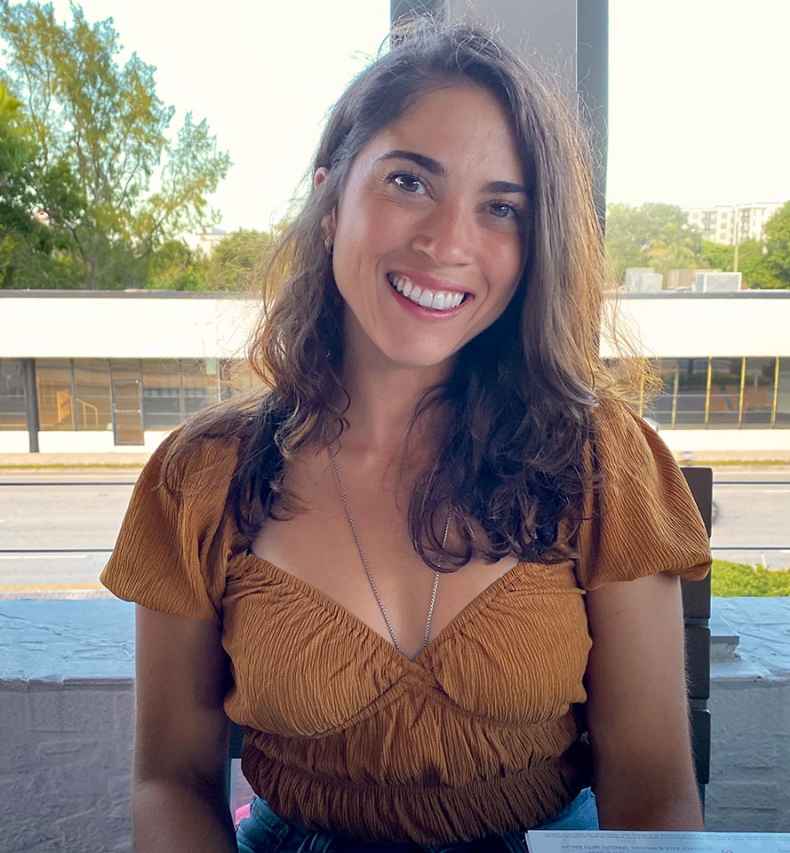 Participant Lilian sitting outdoors on a chair