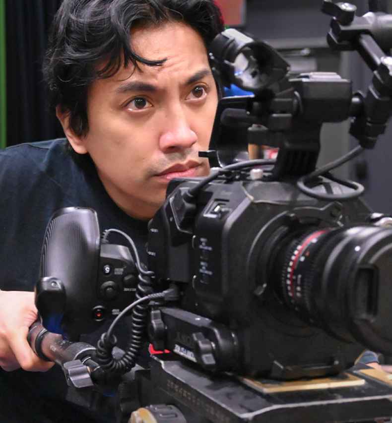 Participant Rodney - person with dark hair holding a video camera