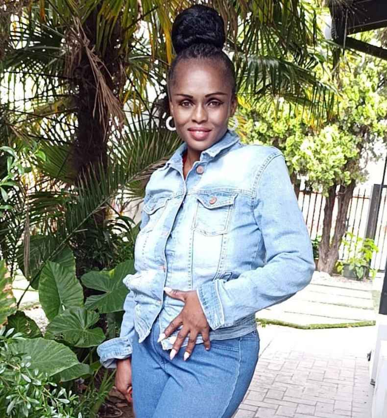 Deconstructing Stigma participant Fancy - person in jeans outfit stands outside