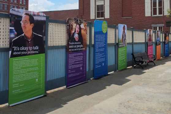 Deconstructing Stigma mobile exhibit poster panels on city street