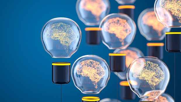 Graphic of light bulbs with lit up brains in them
