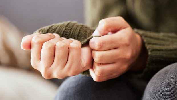 Person picking at hands