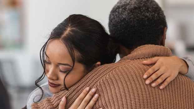 Young person hugging someone