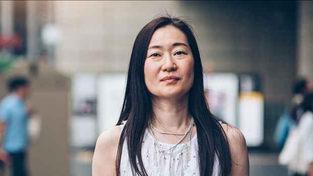 Woman stands in street
