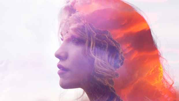 Photo montage of a head with clouds overlaid