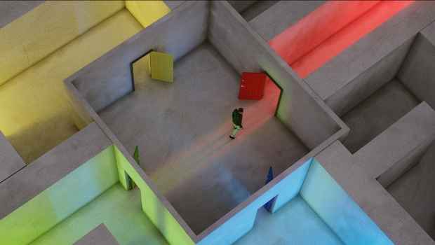 Figure walks through a multicolor lit up maze