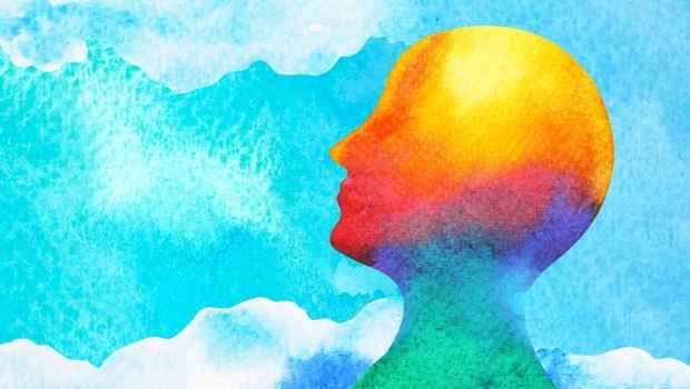 Graphic of a multicolor head on a cloud background, watercolor vibe