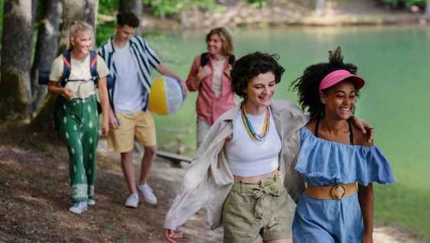 Group of teens walking at lake