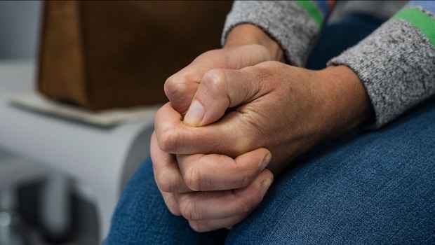 Hands clasped in worry