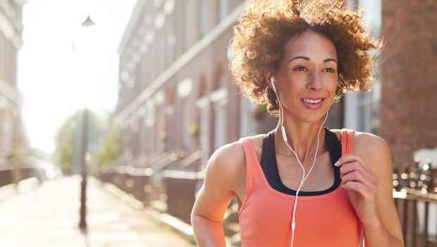 Person running outside in city neighborhood