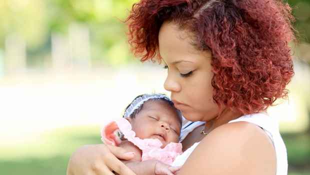 Woman holds baby