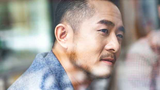 Man giving slight smile