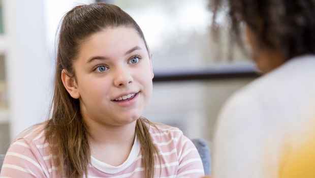 Young person talking to an adult