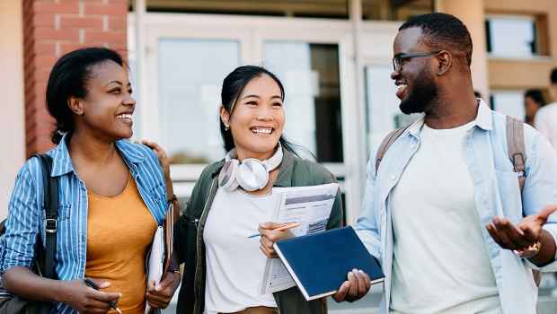 College students talking outside building