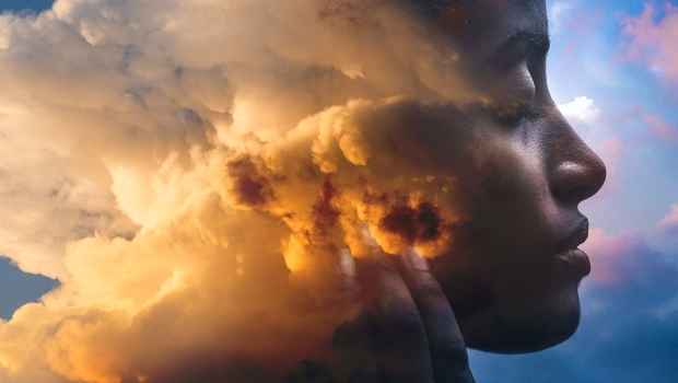 Graphic of clouds in a person’s head