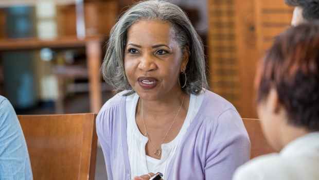 Woman leads a group therapy session