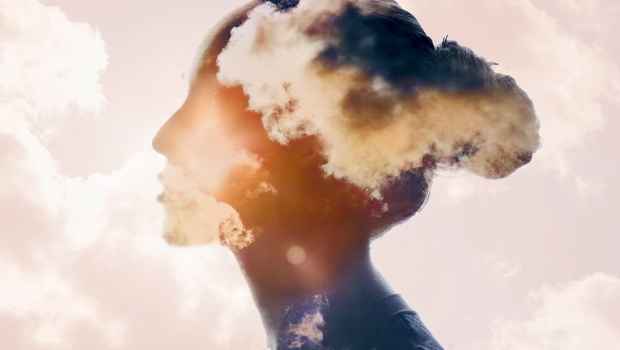 Graphic of head covered with pinkish clouds