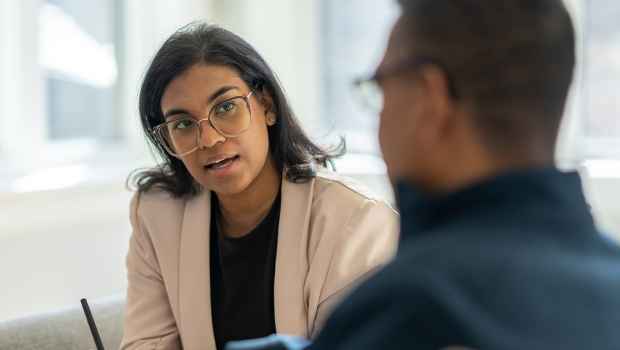 Clinician talks to patient