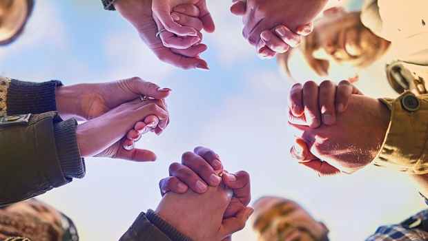 Hands holding in a huddle