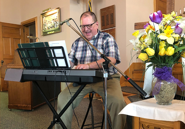 Man playing piano in church