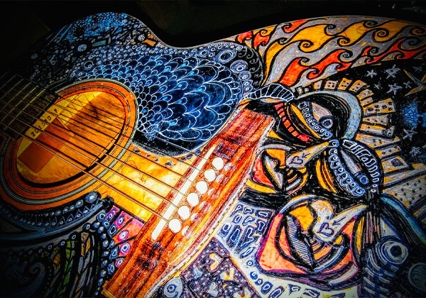 guitar with art painted on it